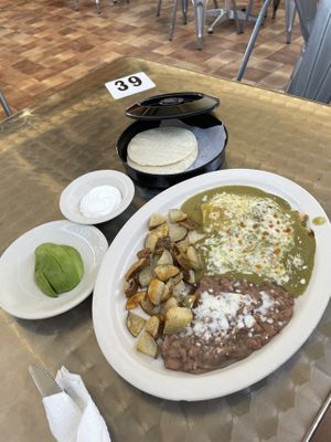 Huevos rancheros (ovo-lacto vegetarian) with green Chile sauce, sour cream and sliced avocado at Habanero's Fresh Mex in Las Cruces