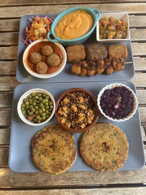 Vegan platter (top) and seitan hamburger (bottom)  at El Vegetariano de la Alcazabilla in Malaga