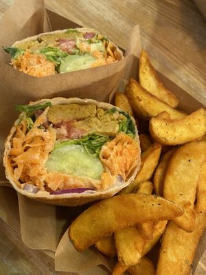 Unchicken burrito with salad and potato wedges  at Edgy Veggy in Sofia