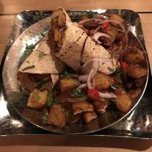 Super tasty vegan wrap and chips. at Mowgli - Grand Central in Birmingham