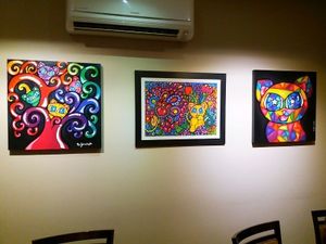 Beautiful paintings. at Cafe com Gato in Sorocaba