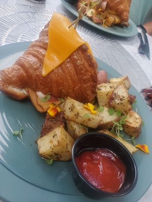 Croque Monsieur Croissant w/ roasted potatoes at L'Artisane Creative Bakery in Coral Gables