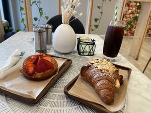 Left - Strawberry Lemon Danish, Right - Almond Croissant; Drink - Iced Americano   at L'Artisane Creative Bakery in Coral Gables