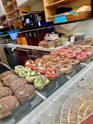 Donut Case😋 (bar-style seating in front on this case!)   at L'Artisane Creative Bakery in Coral Gables