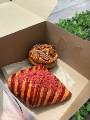 Strawberry basil was amazing. You can’t taste the basil at all and was filled with strawberry jam and cream. The pecan roll, unfortunately, tasted old and was disappointing.   at L'Artisane Creative Bakery in Coral Gables