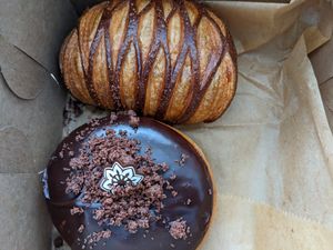 Pain au chocolat (top) and Boston cream donut (bottom) at L'Artisane Creative Bakery in Coral Gables