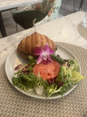 Mushroom croissant with side saladd  at L'Artisane Creative Bakery in Coral Gables