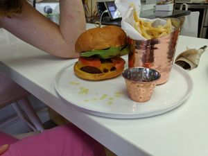 Burger is amazing with aioli mayo, red onions, butter lettuce and a wonderful bun at L'Artisane Creative Bakery in Coral Gables