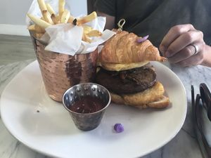 Breakfast sandwich on a croissant at L'Artisane Creative Bakery in Coral Gables