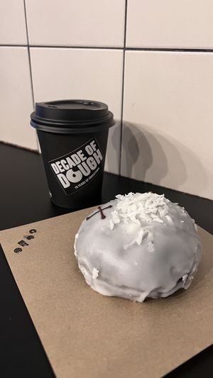 Doughnut and caffee  at Crosstown Doughnuts - Soho in London