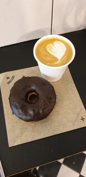 Dark chocolate truffle doughnut and oat flat white at Crosstown Doughnuts - Soho in London