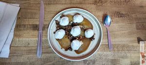 pommes tatin, Tahitian and Madagascan vanilla yoghurt, granola and green schizo. at Les Bols d'Antoine in Paris