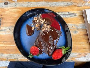 Brownie with strawberriess  at Les Bols d'Antoine in Paris