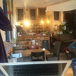 Cozy interior with the piano at Les Bols d'Antoine in Paris