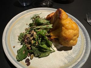 Roasted Cauliflower:
Cauliflower steak, tahini, coconut yoghurt, sumac, dukkha, seeds, parsley, coriander, & mint.   at Old Wharf at MACq 01 Hotel in Hobart