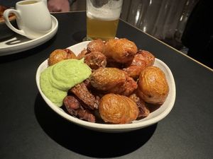 Tasman Potatoes: 
Crispy fried potatoes and green goddess sauce   at Old Wharf at MACq 01 Hotel in Hobart