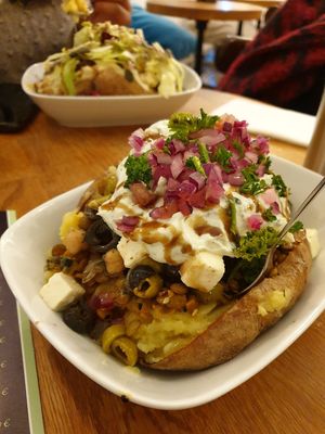 Aristoteles filing with no jalapeños and broad beans swapped for the other lentil options. at Erdapfel in Hamburg