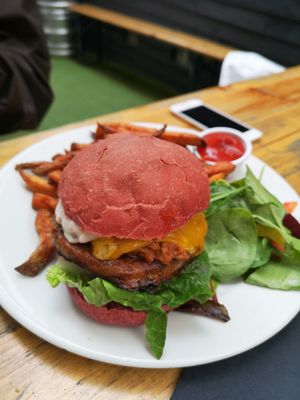 Vegan BBQ burger with beetroot bun and sweet potato fries at The Rose in South East London