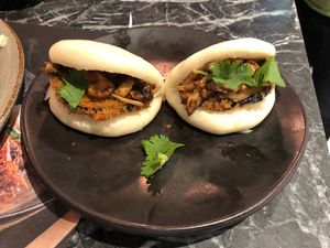 Soft bun with mixed mushroom, aubergine and coriander  at LHR - Wagamama - T5 in West London