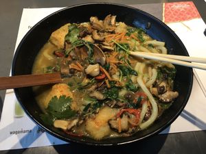 kare burosu ramen.. jam packed with noodles, mushrooms and tofu.. nice kick of heat as well ..  at LHR - Wagamama - T5 in West London