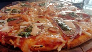 Pepperoni & sausage pizza at Back2Nature Vegan Cafe in Brighton