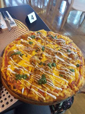 Tandoori chicken pizza at Back2Nature Vegan Cafe in Brighton