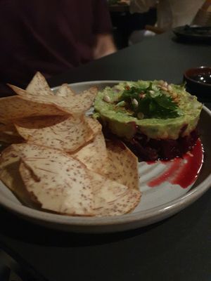 AVOCADO LIME TARTARE:
beetroot tuna, pine nuts, capers, citrus soy, sesame, cilantro, taro chips

contains nuts at PLANTA in Miami Beach
