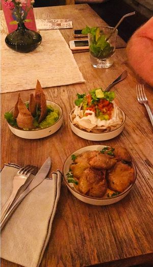 Loaded taro chips, crispy crushed baby potatoes, and crushed avocado salsa at Zest Ubud in Ubud