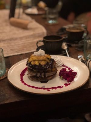 Pancake stack with caramelised banana, chocolate and dragonfruit sauce  at Zest Ubud in Ubud
