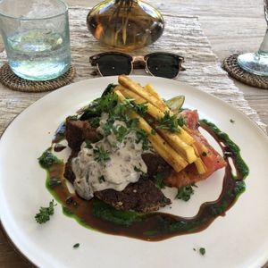 Jackfruit steak with mushroom sauce and shoestring fries  at Zest Ubud in Ubud