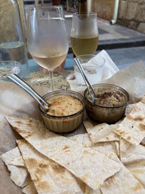 Hummus and babaganoush with drinks on a vibrant patio!  at SAJ in Nice