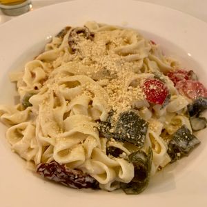 Tagliatelle with dried tomatoes, algae, capers and cashew Parmesan  at Veganeria in Budapest