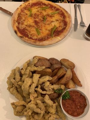pepperoni pizza and the corn jacket seitan with steak fries  at Veganeria in Budapest