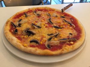Peppino pizza (corn and mushroom) at Veganeria in Budapest