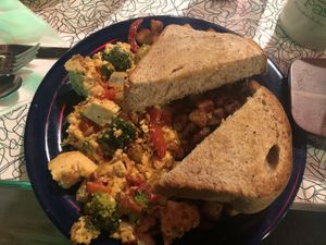 Yummy tofu scramble with vegan cashew sauce and home fries! Beware there is no vegan butter so I had to have this toast replaced with dry toast!  at The Friendly Toast in Portsmouth