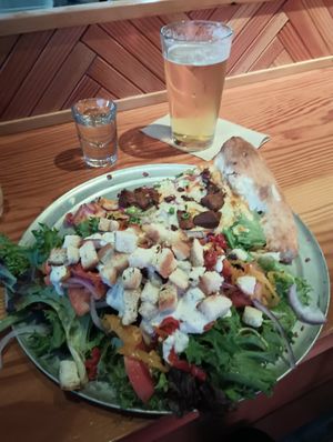 Giant Rabbits salad, slice, salad, beer, and shot combo at Sizzle Pie - Hollywood District in Portland