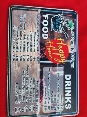 happy hour menu   at the time,  it was 17 pesos to the dollar at El Patio House of Music in Isla Mujeres