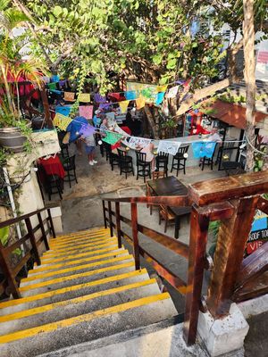 heading downstairs to the lower level restaurant with a separate bandstand, etc at El Patio House of Music in Isla Mujeres