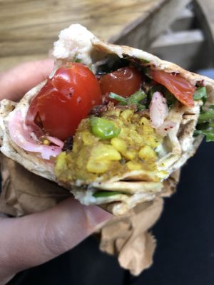 A close up of the inside of the pea fritter wrap!  at St George's Market in Belfast