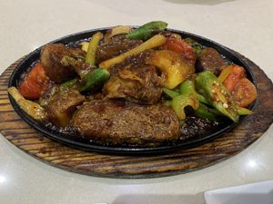 Sizzling fish hot plate at Loving Hut in Cabramatta