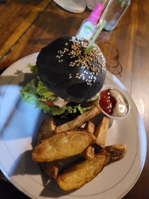 Burger with wedges at Vegan Soul Kitchen in Penida Island