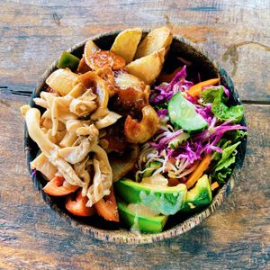 Rainbow Buddha bowl with bbq tofu and tempeh   at Vegan Soul Kitchen in Penida Island