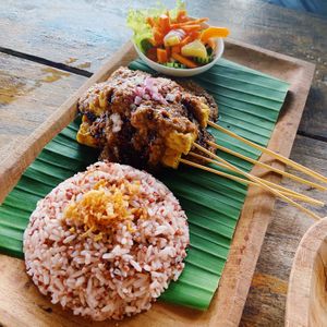 Tempeh satay with wild rice  at Vegan Soul Kitchen in Penida Island