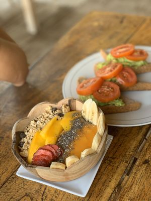 Tropical smoothie bowl & avocado toast at Vegan Soul Kitchen in Penida Island