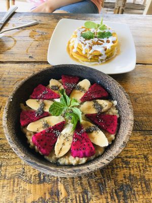 Fruit porridge and pumpkin pancakes for breakfast  at Vegan Soul Kitchen in Penida Island