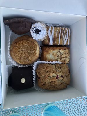 From top left: peanut butter patty; fruit tart; pistachio cake; almond cake; lingonberry coffee cake; peanut butter brownie; coconut caramel cake    at Carina's Bakery in Beaverton