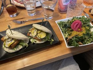 Tofu bao buns and side vegan caesar salad  at Atomica in Kingston