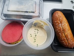 Rutabaga fondue with soft pretzel and house pickles (to go) at Fancy Radish in Washington