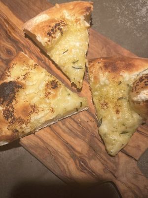 garlic and cheese focaccia starter (there were double the pieces but i was hungry 😬👀)  at Café Piccolina in Aarhus