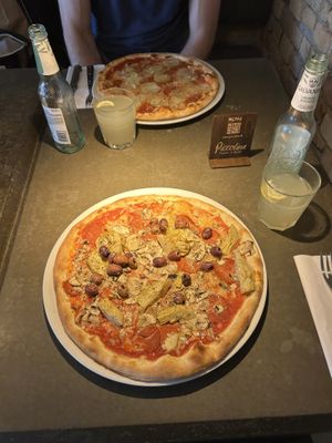 Pizza 105 (principessa) with vegan cheese, vegan salami, artichokes, olives and mushroom  at Café Piccolina in Aarhus